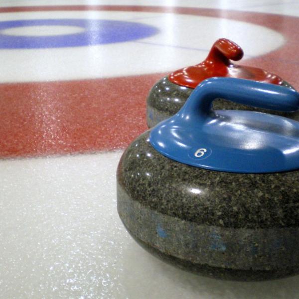 Curling_stones_on_rink_with_visible_pebble(1)